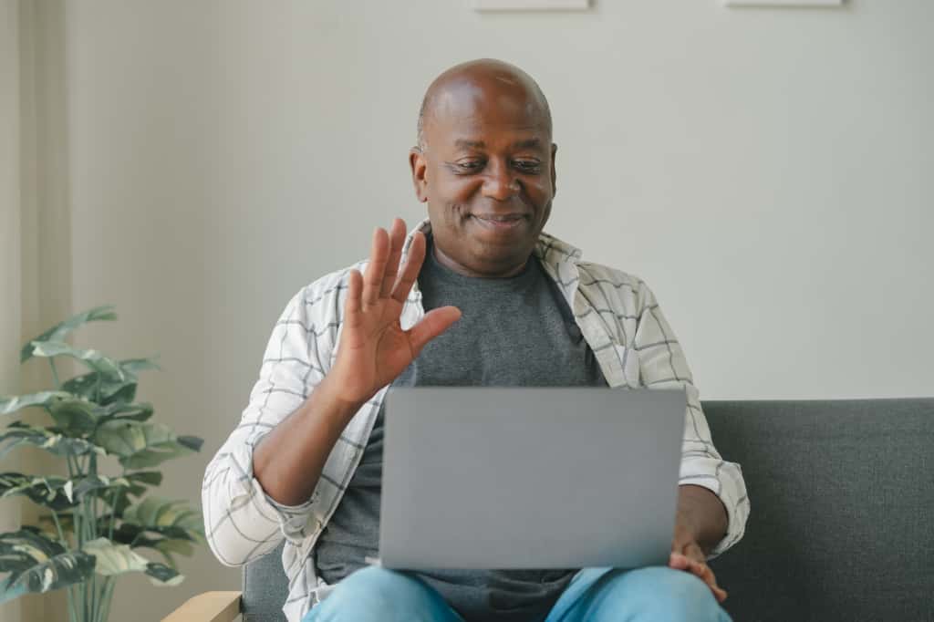 Nigerian professional abroad discussing real estate investment with a consultant via video call | The Property Garage